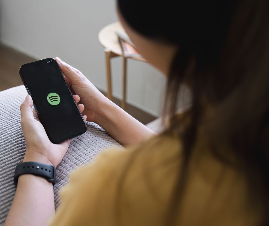 spotify Person Holding an Iphone
